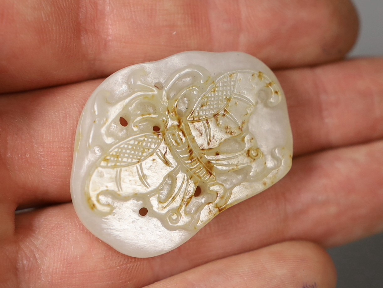 A Chinese white and russet skin jade ‘butterfly’ plaque, 3,5 cms long